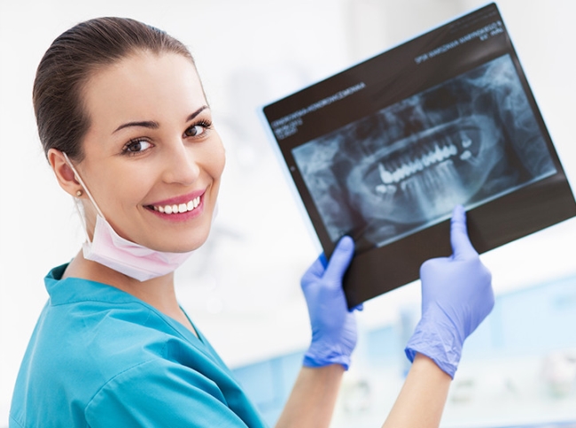 A dentist showing a dental x-ray