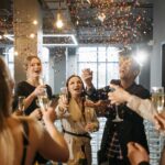 Picture of adults in their 40s celebrating at a party.