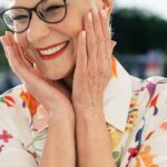 A smiling older woman looking young and happy.