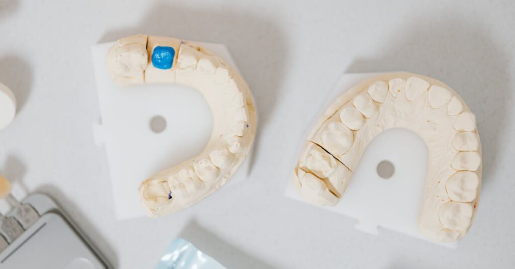 Close-up of dental molds on a white table, showcasing orthodontic details.