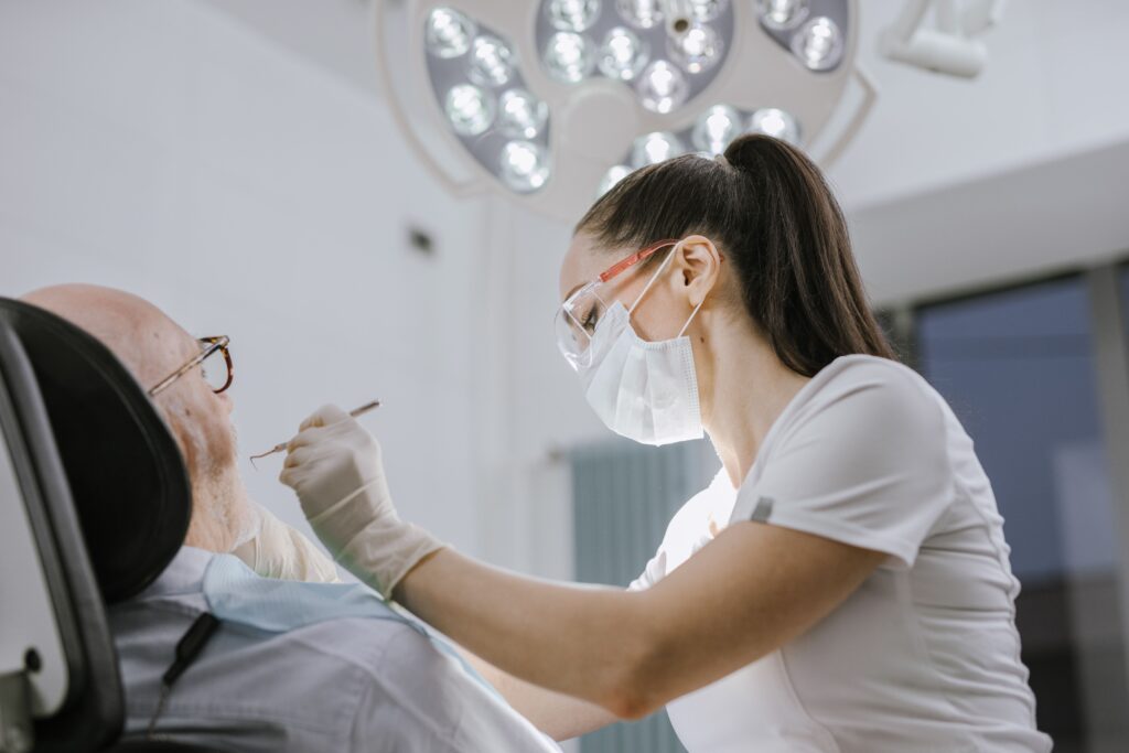 A dentist working on a dental patient.