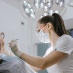 A dentist working on a dental patient.