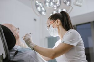 A dentist working on a dental patient.